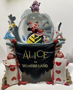 the alice in wonderland figurine is on display