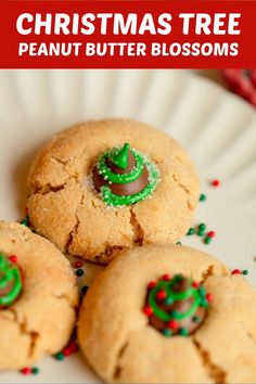 three christmas tree peanut butter blossoms on a plate