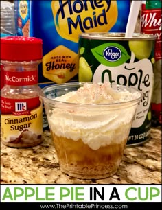 an apple pie in a cup is sitting on the counter next to some other ingredients