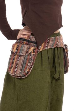 Are you looking for a roomy, sturdy waist bag for all your festival bits and pieces? This is a double pocket belt made of woven Nepali gheri cotton. It fastens with a plastic buckle. It has five pockets in total, two one each side plus a hidden one on the back of one of the sides. Each side has a zippered section measuring 8 x 6" Underneath the zip section is a pocket a flap with a magnet button on it and also a zipper, and measures 6 x 6.5 x 1.3". Inside the belt on one side is a hidden zippered section measuring 5.5 x 8".  SIZE  ONE SIZE: Smallest Setting: 30" (78 cm) Largest Setting: 40" (102 cm) THIS LISTING IS FOR BROWN Code: Hippy Gheri Belt (RGHIPPY) Hippie Belt, Upcycled Bags, Arcane Oc, Unique Gifts For Boyfriend, Custom Leather Belts, Festival Belt, Upcycled Bag, Money Belt, Handmade Belts