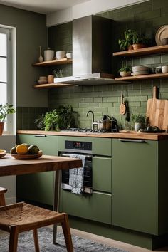 a kitchen with green walls and wooden shelves