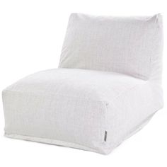 a white chair sitting on top of a white floor next to a pillow in the shape of a recliner