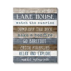 a wooden sign that says lake house watch the sunrise, jump off the dock make a bonfire go barefoot catch fire relax and explore