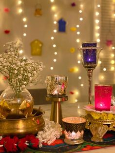 a table topped with lots of candles and flowers