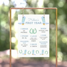 a first year sign hanging from a metal stand