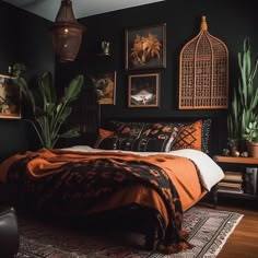 a bed room with a neatly made bed and pictures on the wall