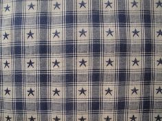 a blue and white checkered fabric with stars on it