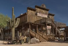 an old western town with a large cactus in the foreground and saloon on the other side