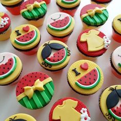 some cupcakes are decorated with different designs