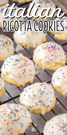 italian ricotta cookies with white frosting and sprinkles on a cooling rack