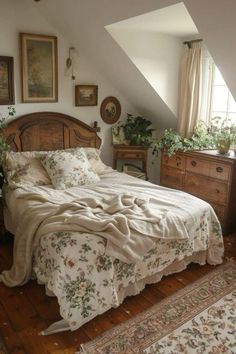 a bed sitting in the middle of a bedroom next to a dresser and window on top of a wooden floor