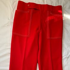 These Are Amazing Vintage Pants From The 60s And 70s. Unique White Stitching. Excellent Vintage Condition, Looks Like They Were Never Worn. Bought At A Vintage Shop And Sadly They Don’t Fit Me. Waist 15 Inches, Rise 12 Inches Vintage Red Pants With Pockets, Retro Red Bottoms For Spring, Retro Fitted Red Pants, Vintage Red Wide Leg Pants, Vintage Red Fitted Bottoms, Red Fitted Vintage Bottoms, Retro Red Workwear Bottoms, Retro Red Bottoms For Workwear, Retro Red Bottoms For Work