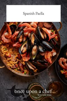 spanish paella with shrimp and mussels in a skillet