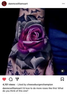 a person's hand with tattoos and a rose on it