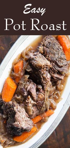 a bowl filled with beef and carrots on top of a wooden table