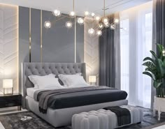 a bedroom with a large bed and chandelier