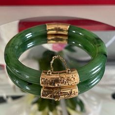 Vintage Apprx 1960's Chinese Gold And Jade Bangle. The Bangle Is Made From A Drak Green Nephrite Jade Stone And Gold Ends. It Has A Safty Chain Which Was Recently Fixed As It Was Broken. It Is In A Great Vintage Condition. No Stamp On The Gold But It Tested Higher Than 10k But Lower Than 14k. Inside Measurement Is 2 1/4 Inches And It Weighs 32.14 Grams. Jade Jewelry Chinese, Chinese Jade Jewelry, Chinese Gold, Chinese Jewelry, Chinese Jade, Jade Bangle, Nephrite Jade, Ancient Jewelry, Jade Jewelry