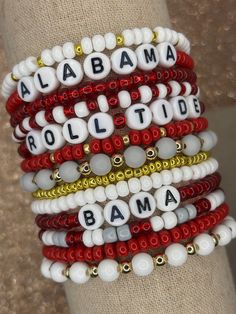 The ultimate bracelet listing for any University of Alabama fan! Roll Tide! These bracelets are SOLD INDIVIDUALLY & as a STACK of 13! If wanting multiple bracelets, please add each one individually to your cart! Bracelets with letter beads can be personalized to exchange for a different word/name or player number. PERSONALIZATION IS *ONLY* FOR BRACELETS THAT COME WITH LETTER BEADS! (This is important as we have different price points for our goods!) Please use the personalization box if wanting this; otherwise, your bracelet will come as pictured! Personalization Box: PERSONALIZATION ONLY APPLIES TO BRACELETS PICTURED WITH LETTERED BEADS! Please add name/word/player number exactly as you want it on your bracelet. We use Czech glass beads and  gold colored beads to create these spirited bra Alabama University, Inspired Bracelets, Alabama Fans, Bracelet Stacks, Multiple Bracelets, Alabama Roll Tide, Jewelry Roll, Bow Bracelet