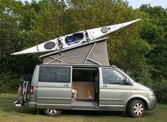 a van with a kayak attached to the roof