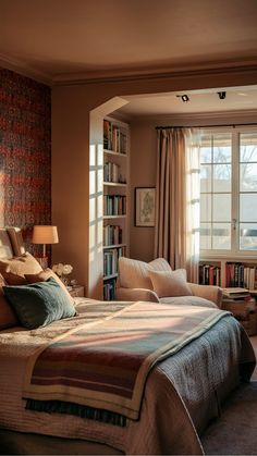 Cozy bedroom with a large bed, a reading nook with an armchair, a bookshelf, and sunlight streaming through the window. Bedroom Ideas Cozy Warm, Bedroom Color Schemes Relaxing, Cozy Bedroom Aesthetic, Cozy Bedroom Decor, Cozy Bedroom Colors, Plush Rugs, Blankets Soft, House Ceiling Design, Relaxing Space