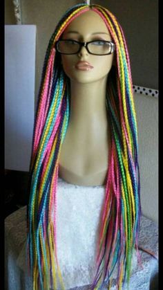 Multi coloured Box braids on a lace closure All our braided wigs are handmade wigs, carefully hand-picked and crafted by selected professional braiders. We bleach the knots for a very realistic look. We provide babyhair in all our wigs, if you do not need it, you can take it off or add note to that effect. All our wigs comes with the big elastic band, our full lace wigs comes with the adjustable straps and combs and can be put in a Ponytail. Our frontal comes with a breathable cap and elastic ba Black Women Twists, Box Braids Rainbow, Faux Locs Wig, Braided Wigs For Black Women, Cornrow Wig, Black Box Braids, Colored Box Braids, Dreadlock Wig, Rainbow Braids