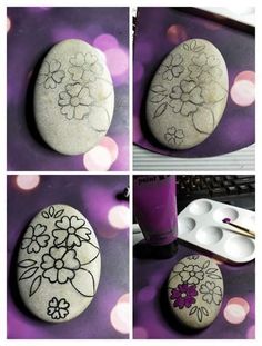 some rocks with flowers painted on them