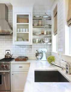 the kitchen is clean and ready to be used for cooking or baking, but it's not too crowded