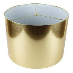 a round metal table with a gold finish on the top and bottom, against a white background