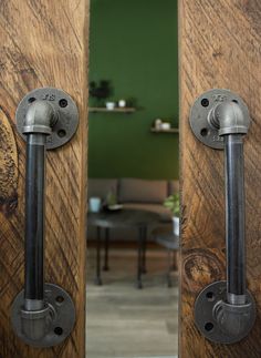 two wooden doors with metal handles and knobs