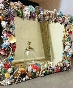 there is a mirror that has many beads on it