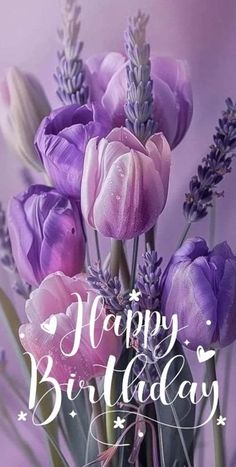 purple tulips and lavender flowers are in a vase with the words happy birthday