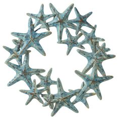 a wreath made out of sea stars on a white background