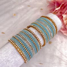 2 small half stacks of antique Gold bangles with light blue. Ready to Ship! Packed loose in small gift box. (No roll) Antique Gold Bangles, Bridal Survival Kit, Blue Bangles, Blue Gold Wedding, Bangle Box, Colorful Bangles, Hand Harness, Gold Bangle Set, Bridal Choker