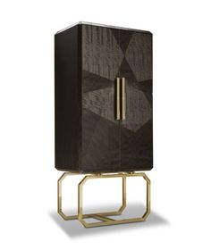 an art deco cabinet with gold accents and geometric design on the front, it is made out of wood