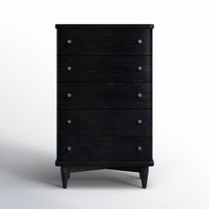 a black chest of drawers with brass knobs on the top and bottom, against a white background