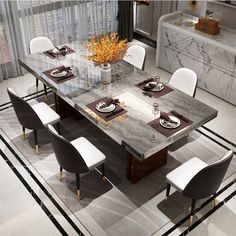 a dining table with white chairs around it