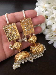 It's elegant and classic...the matching earrings perfect match for style statement.... This beautiful and traditional thappa kundan jhumka earrings in kundan and gold plating made for someone special like you.. Grab it before anyone else! Color: gold In stock and ready to ship... India Jewelry Traditional, Pakistani Jhumka Earrings, Pakistani Jewelry Earrings, Ornate Jhumkas For Wedding, Luxury Traditional Jhumkas, Formal Jewellery, Nikkah Favors, Luxury Gold Ornate Jhumkas, Kundan Jhumka Earrings