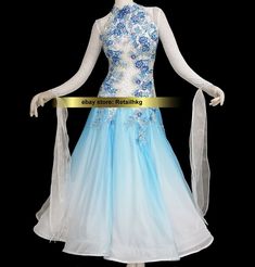 a blue and white dress with flowers on the bouncy skirt is displayed in front of a mannequin