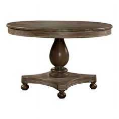 a round wooden table with wheels on the bottom and an oval top, sitting on casteors