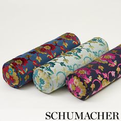 three rolls of fabric sitting next to each other on top of a white surface with the words schumacher