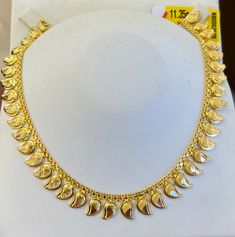 "Indian designer mango choker necklace , 916 Yellow Gold GOLD PURITY : pure 22k / 916 gold purity Appx Weight: 11.30 grams Length  :  adjustable upto 18\" inches Length  Colour : YELLOW GOLD Hallmark: Hallmarked 916 stamp Hook: '' fish hook Design  :Beautiful choker necklace indian style mango necklace set.  Authentic 916 Gold FAQs Q: Is it real gold? A: yes it's real authentic genuine 916 gold  Q: can pawn? A: yes it's pawnable ⭐️GoForGold⭐️ It's time to stock on up gold" Luxury Yellow Gold Necklaces For Navratri, Mango Necklace Indian Gold, Choker Necklace Indian, Mango Design, Indian Mango, Mango Necklace, Indian Choker Necklace, Beautiful Chokers, Necklace Indian