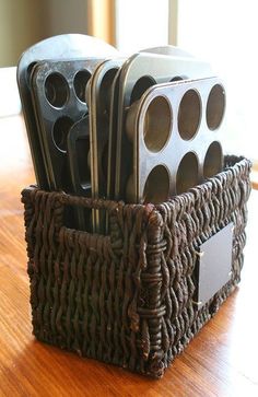 a brown basket filled with lots of metal items