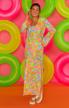 Beach bound with drink in hand in this vibrant rainbow coverup. The Santos Coverup is a mesh maxi with long sleeves and a v-neck. Throw on over a bikini with strappy sandals and straw hat for the perfect vacay vibe! Straw Hat, Strappy Sandals, Straw, Cover Up, Neon, Rainbow, V Neck, Sandals, Long Sleeve