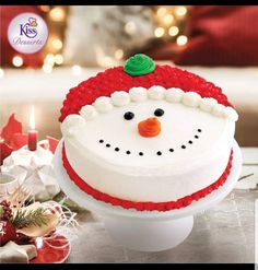 there is a cake decorated like a snowman