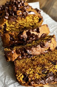 slices of chocolate chip pumpkin bread on top of parchment paper with one slice cut off