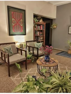 a living room filled with furniture and lots of plants