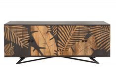 the sideboard is made out of wood and has an artistic design with leaves on it