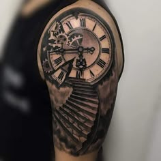 a man with a clock tattoo on his arm