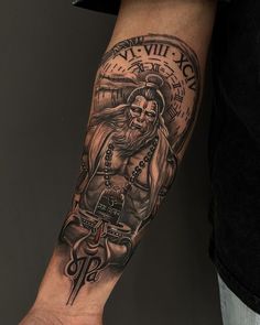 A man's forearm bears the wise image of an Eastern sage, enveloped by the mystic aura of ancient scripts and a time-worn clock. This tattoo could represent a reverence for knowledge passed down through generations or a philosophical reminder of the relentless march of time. The sage's intense gaze and the Sanskrit mantras speak of a search for deeper truths, making this design an intriguing option for those seeking man tattoo ideas with a philosophical edge. Jai Shree Ram Tattoo For Men, Hanuman And Mahadev, Shiva Tattoo Design For Men Hand, Hanuman Ji Tattoo Design On Hand, Jai Shree Ram Tattoo Design, Shiva Tattoo Design For Men Arm, Hanuman Tatoos Design, Hanumanji Tattoo Design, Shree Ram Tattoo For Men