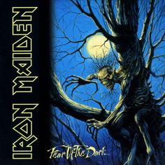 the cover art for iron maiden's year of the dark album, featuring an image of